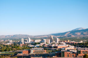 Image of the skyline of Reno Nevada with the University of Nevada Reno in the foreground.